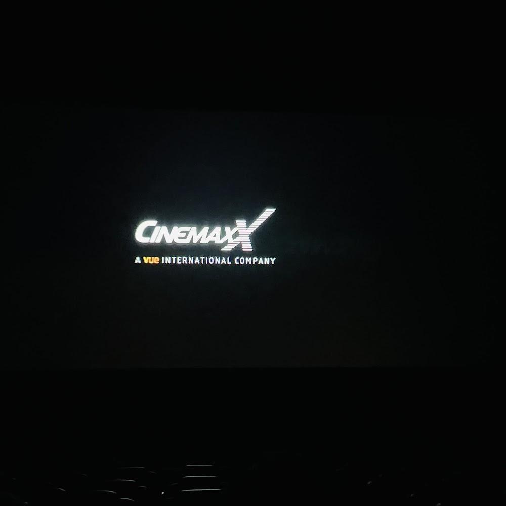 A movie theater screen displaying the Cinemax logo.